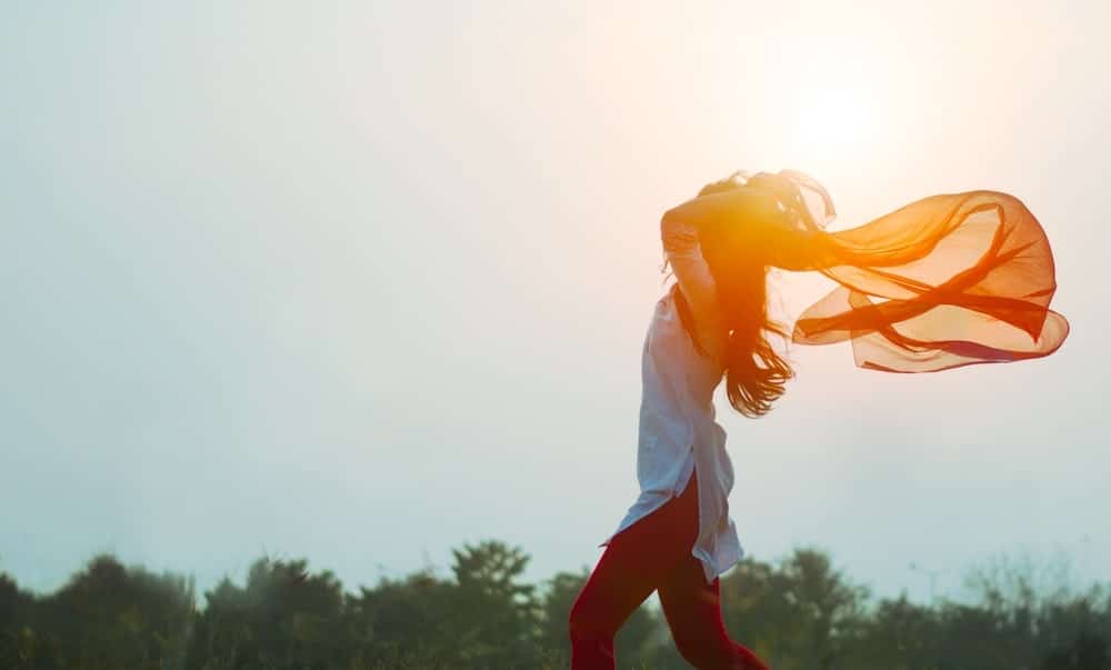 Image of a joyful happy woman running