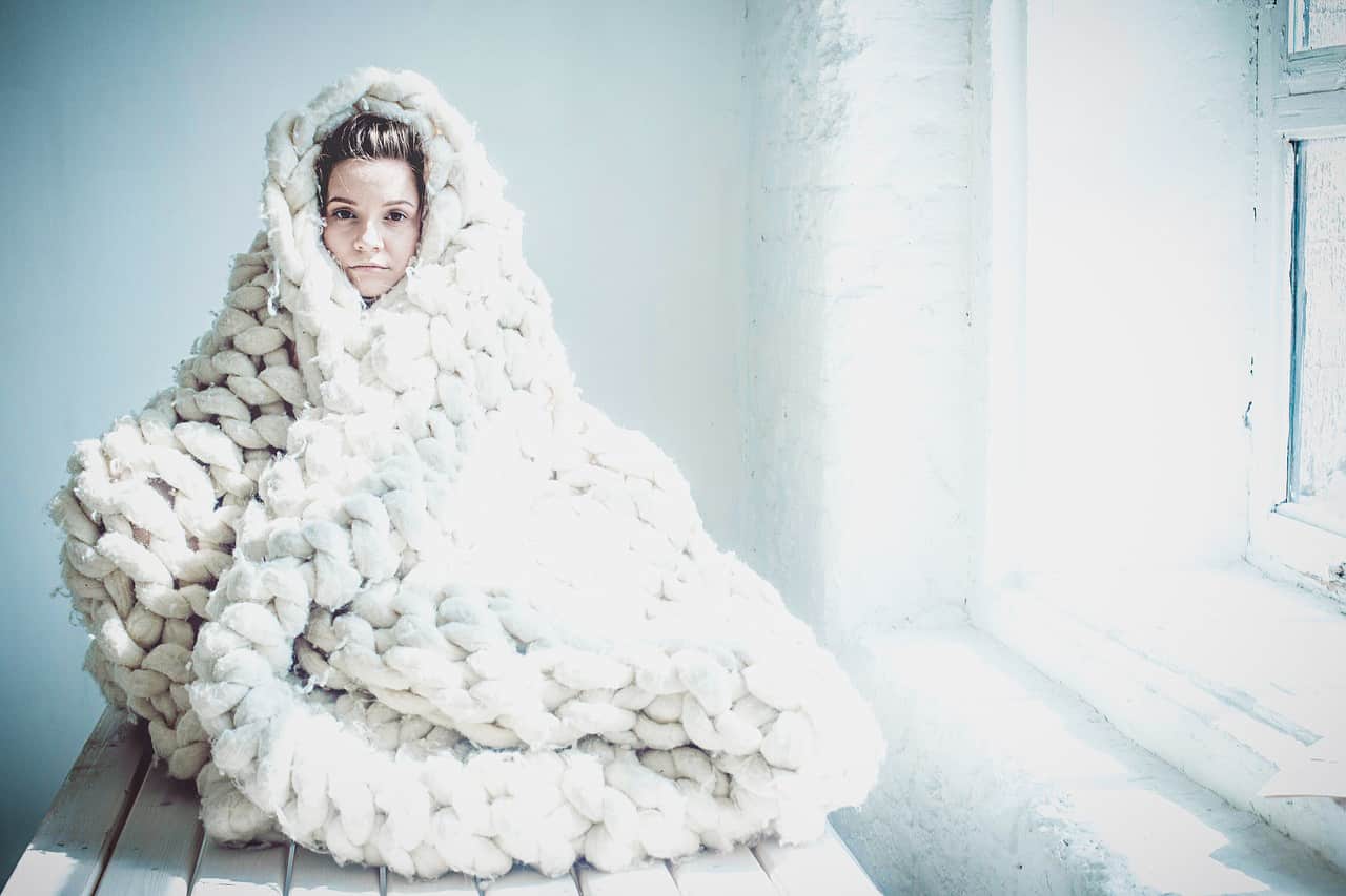 Image of a highly sensitive woman in a blanket