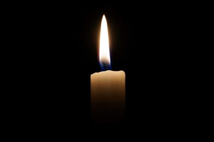 Image of a candle in the dark representing spiritualism