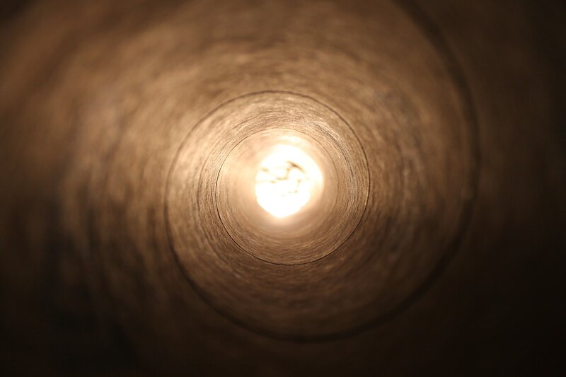 Image of a light in a tunnel symbolic of inner work