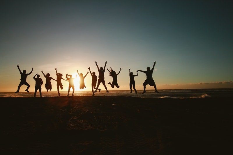 Image of a happy soul family on the beach