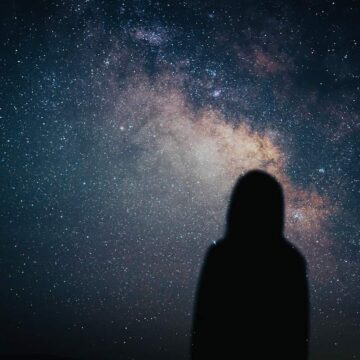 Image of a person watching the stars passively symbolic of someone struggling with soul loss