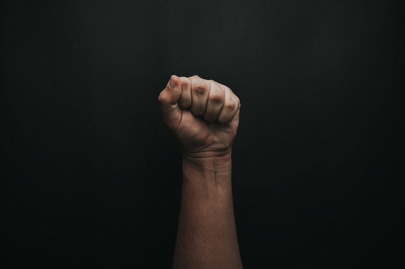 Image of a closed fist symbolic of fear and control