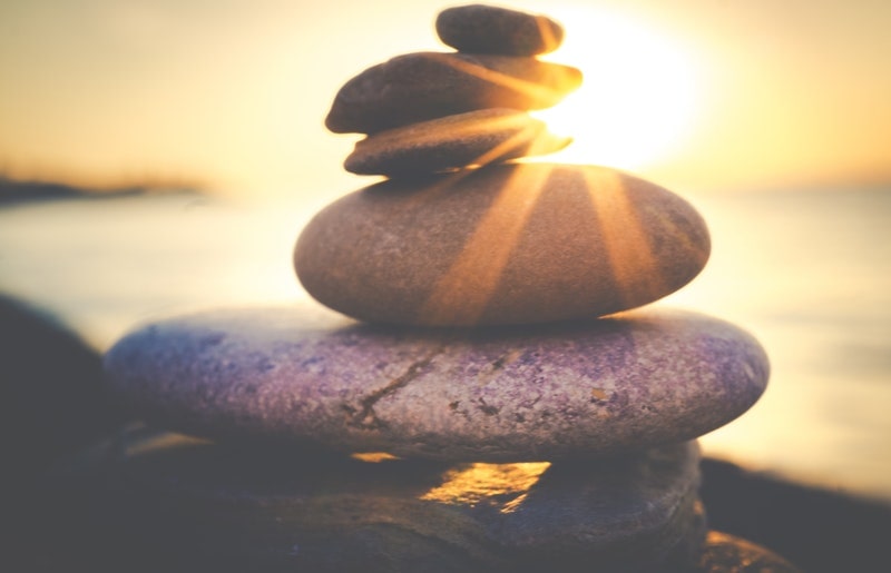 Image of a zen pile of stones on the beach