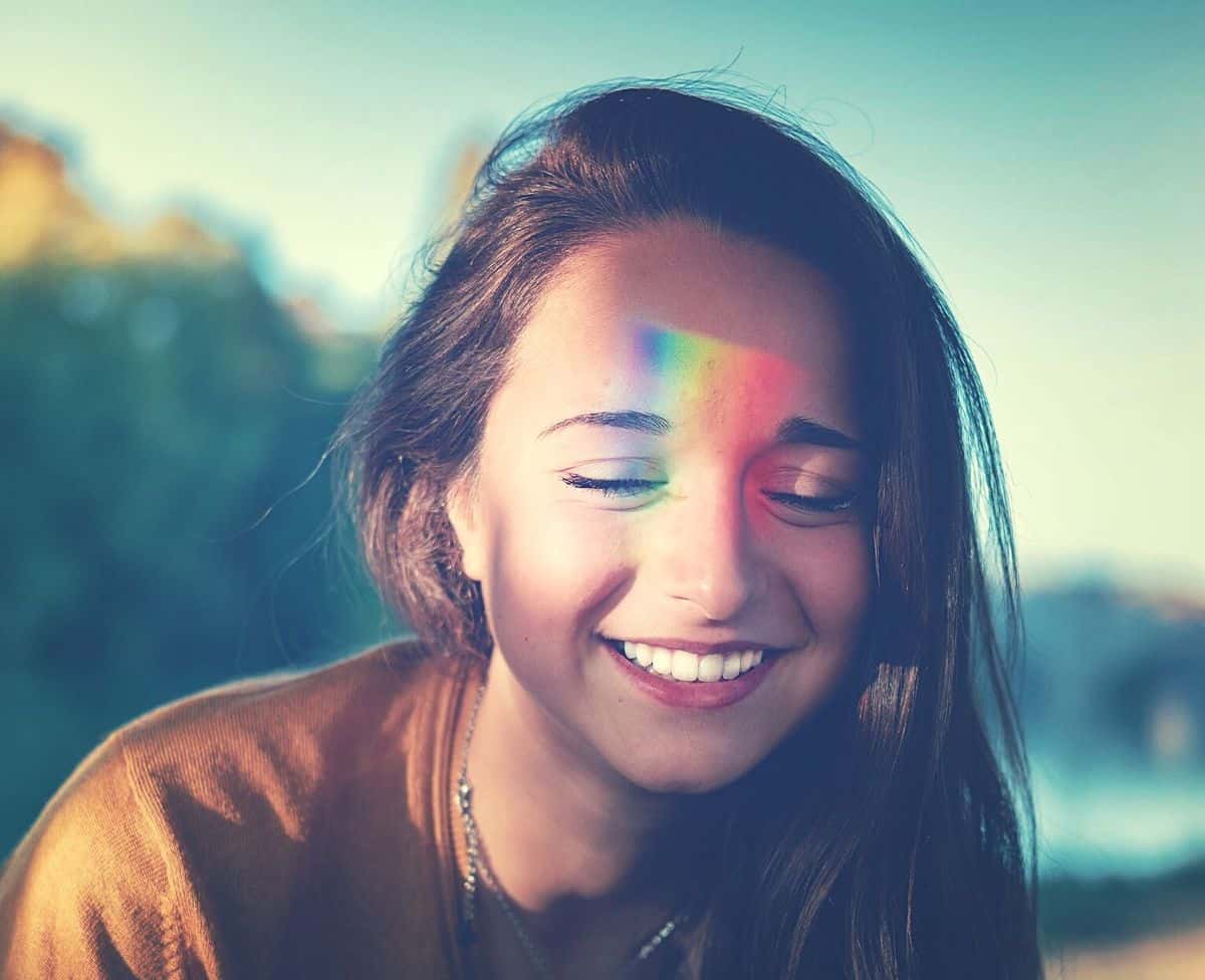 Image of a happy woman undergoing chakra balancing