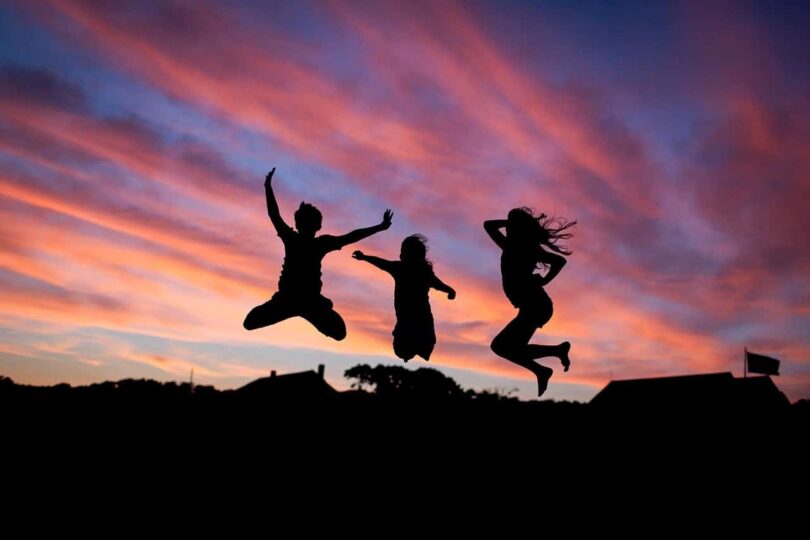 Image of happy people jumping together