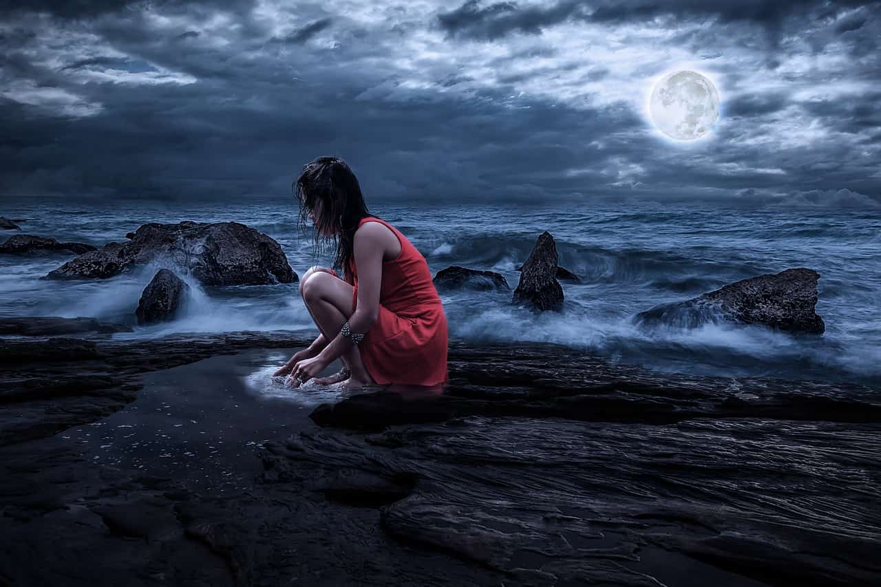 Image of a woman and the moon suffering from soul loss needing soul retrieval