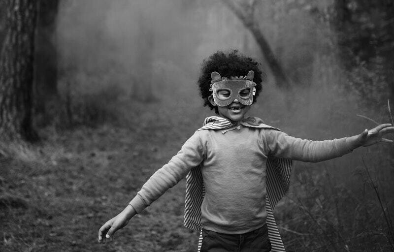 Image of a happy child running in an animal costume