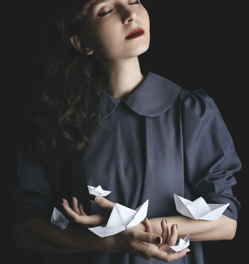 Image of a woman doing the mindfulness exercise of origami