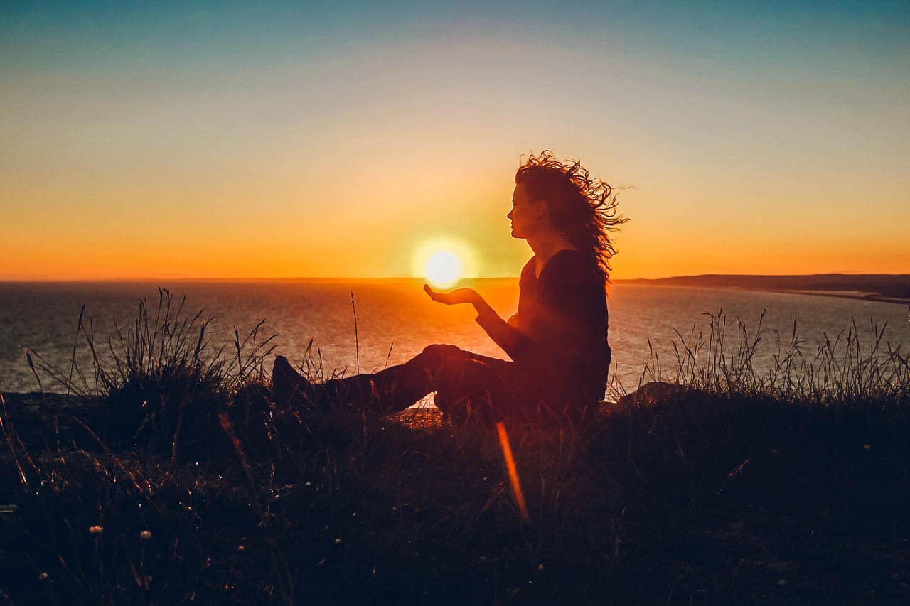 Image of a woman symbolically letting go experiencing a spiritual awakening