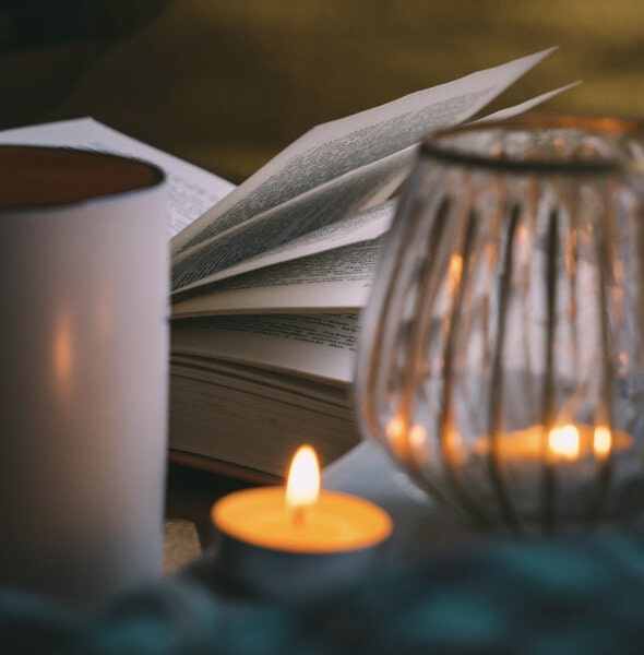 Image of a journal next to a candle