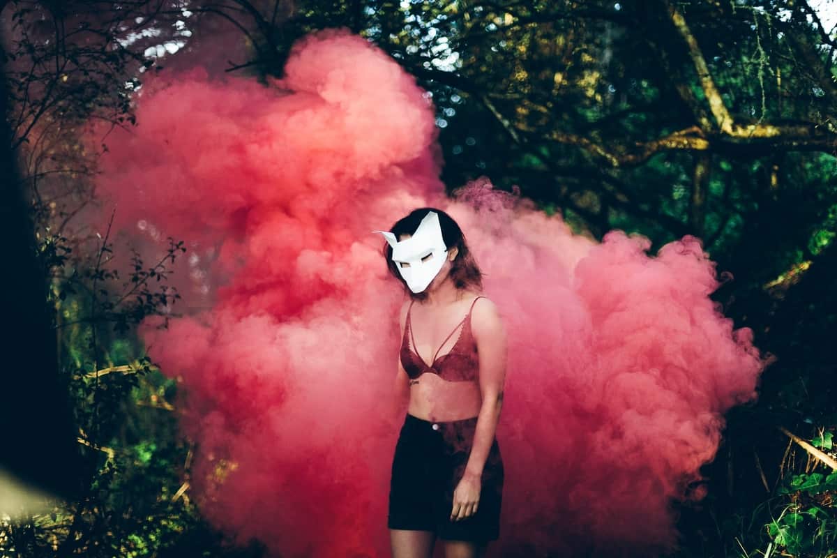 Image of a wild wolf woman in billowing smoke