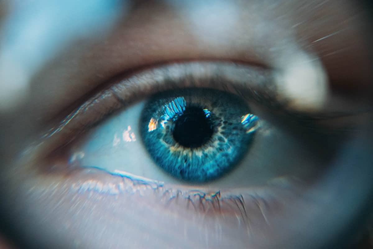 Image of a blue eye experiencing self-awareness