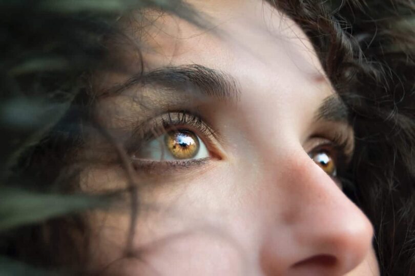 Image of a woman's eyes experiencing self-awareness