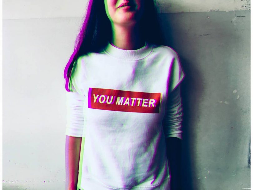 Image of a woman wearing a shirt that says You Matter who has good personal boundaries