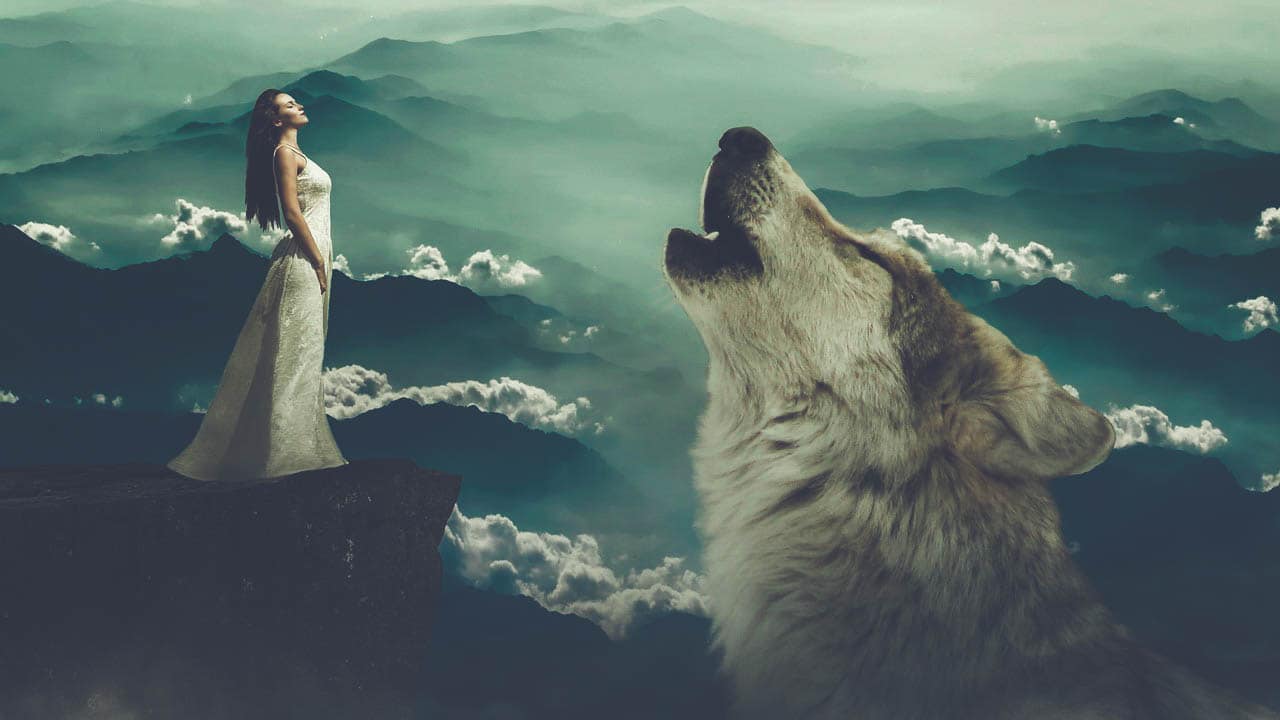 Image of a free spirit woman and a wolf howling