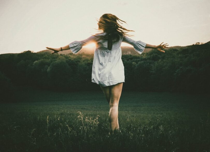 Image of a free spirit woman in nature running