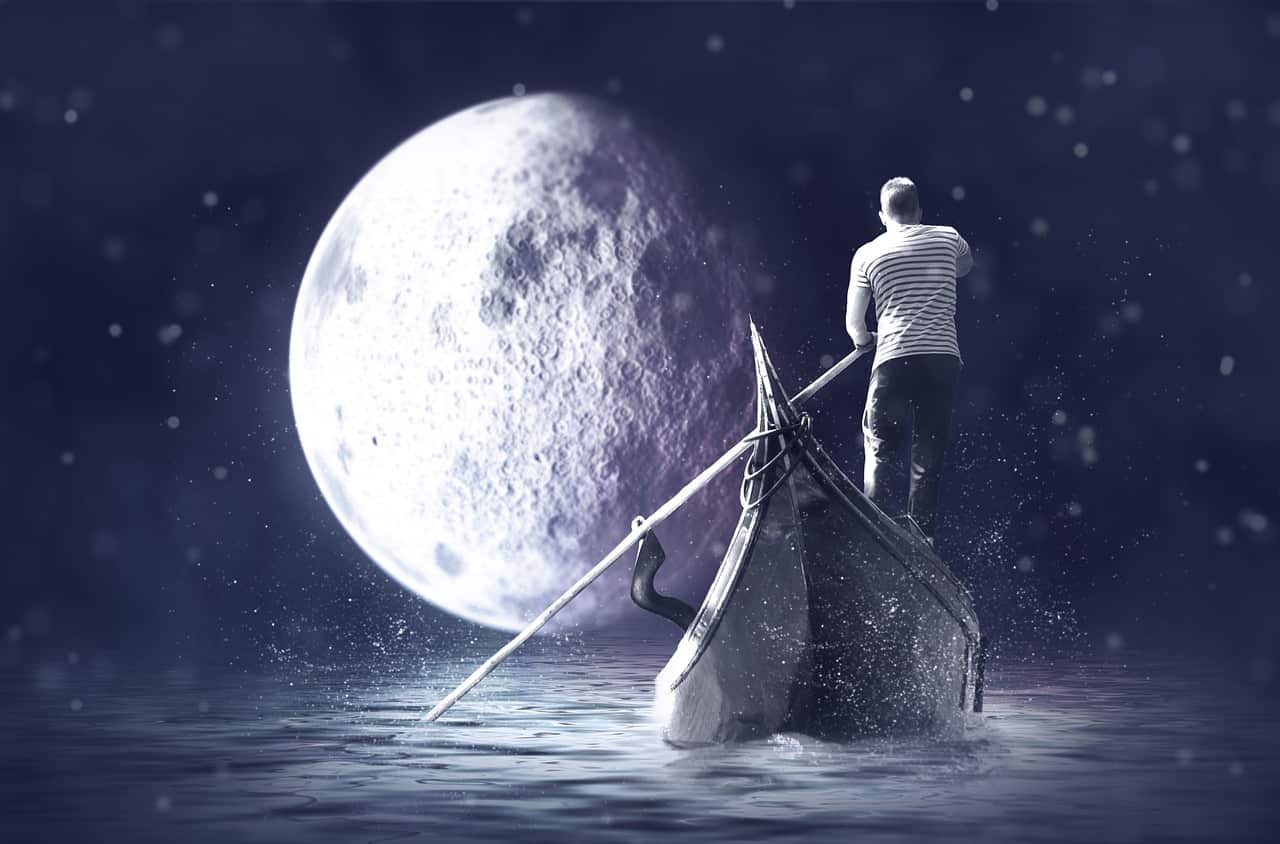 Image of man on gondola and moon