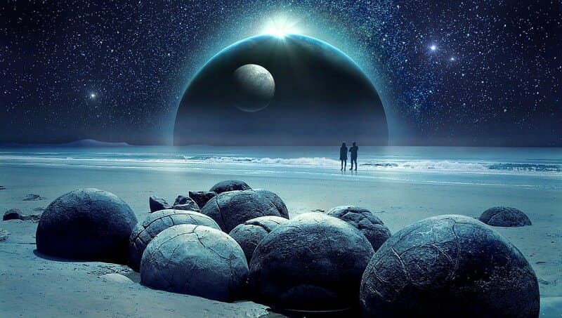 Image of two people on a mystical beach trying to interpret synchronicity