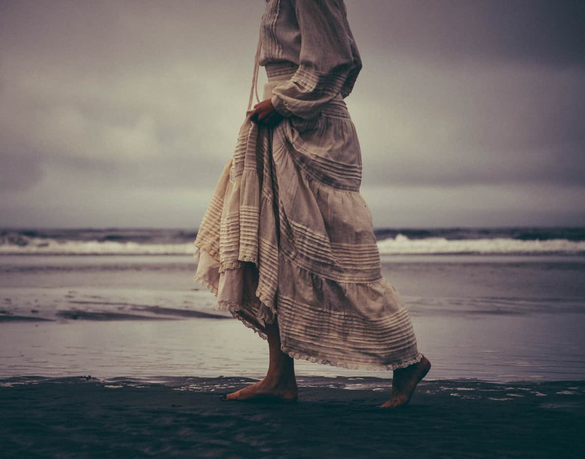 Image of a lost woman on the beach