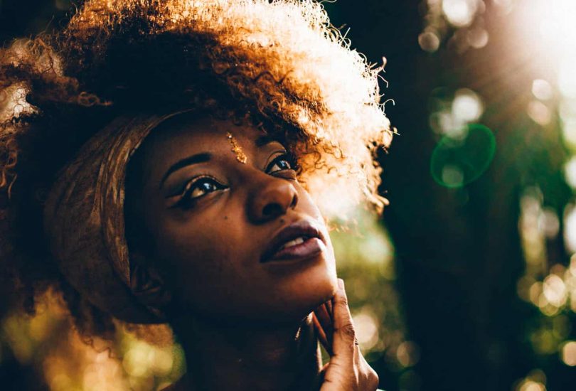 Image of an intuitive woman staring at the sunlight