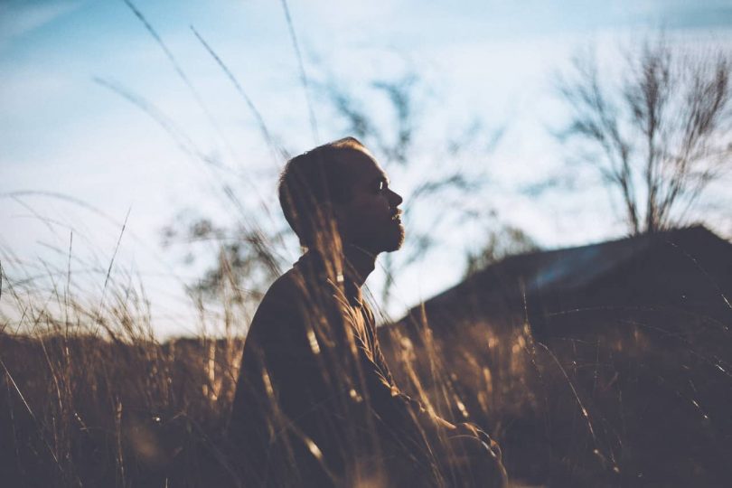 Image of a man practicing breathwork in nature