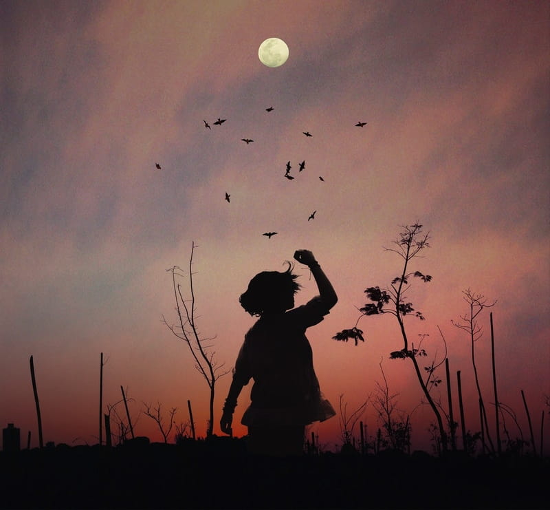 Image of a child and the moon at sunset symbolic of the mystical experience