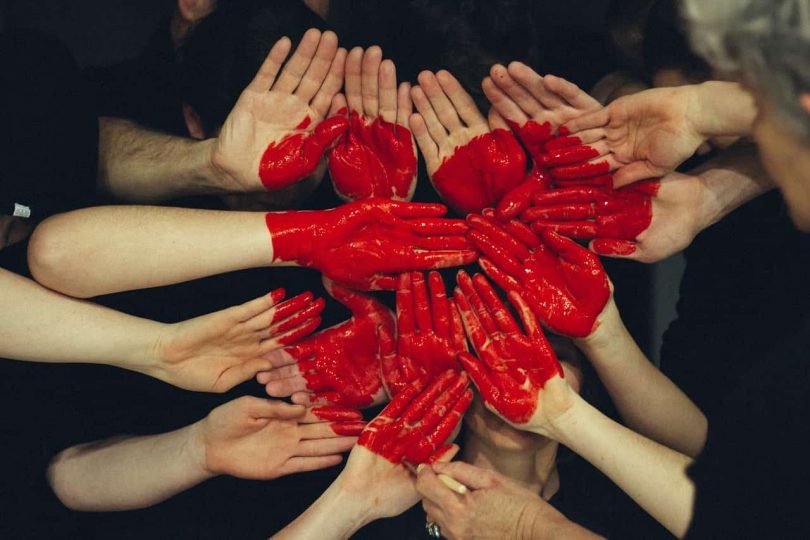 Image of a group of hands representing internal family systems therapy