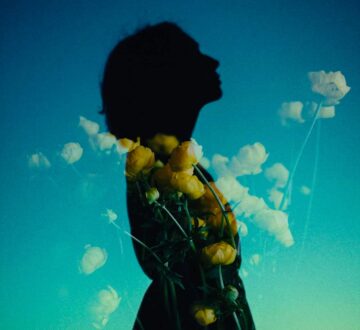 Double exposure image of a woman with flowers symbolic of the inner child