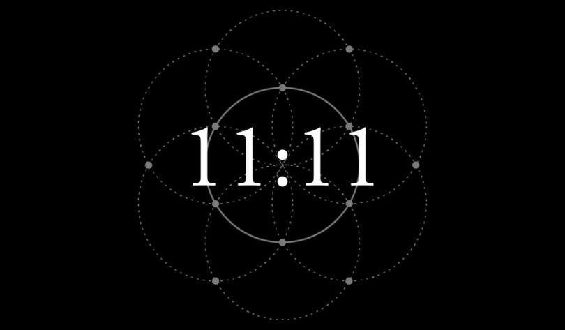 Picture of the number 11:11 against a black background