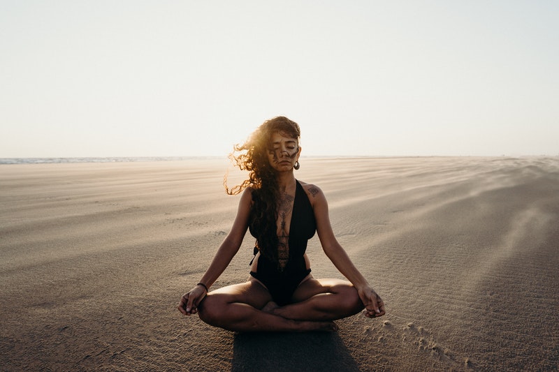 Image of a woman practicing yoga and embodied spirituality