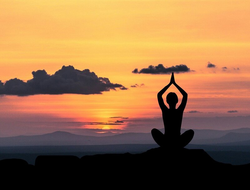 Image of a woman in a yoga meditation pose