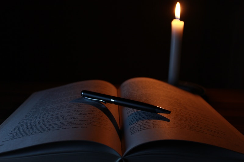 Image of a mysterious journal in the candle light