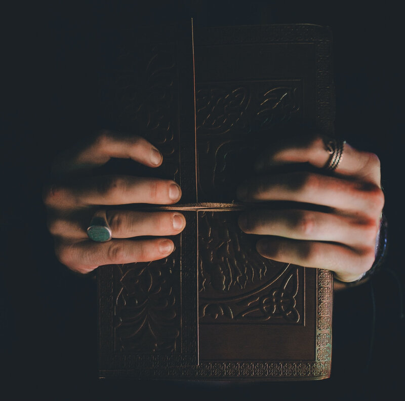 Image of a person holding a spiritual journal