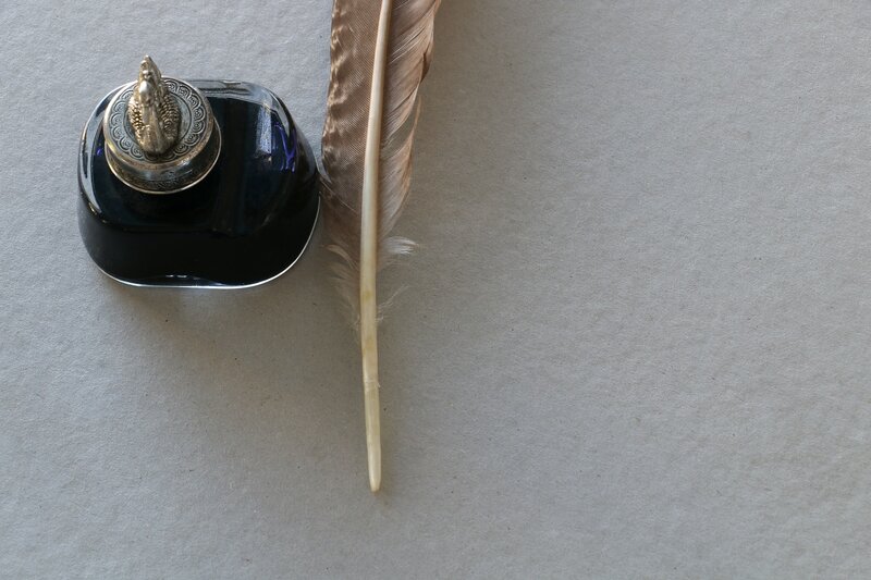 Image of a quill and ink used for spiritual journal