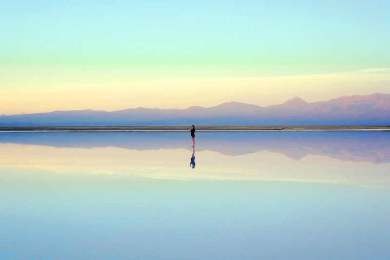 Image of a person alone on a blue landscape