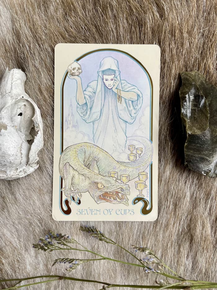 Image of the seven of cups card symbolic of false identity scripts