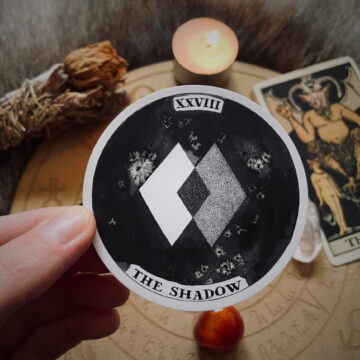 Image of some tarot and oracle cards symbolic of tarot shadow work