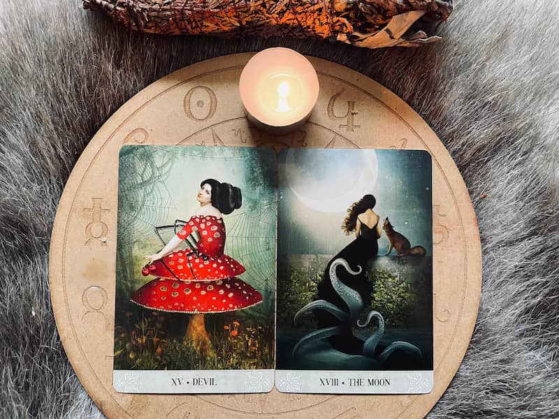 Image of the Devil and the Moon card together for tarot shadow work