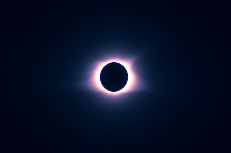 Image of a black sun symbolic of nigredo in alchemy