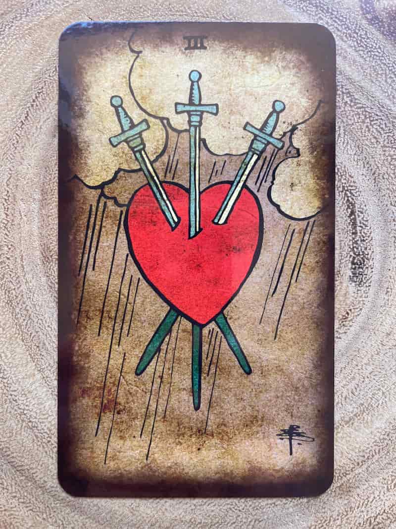 Image of the three of swords tarot card