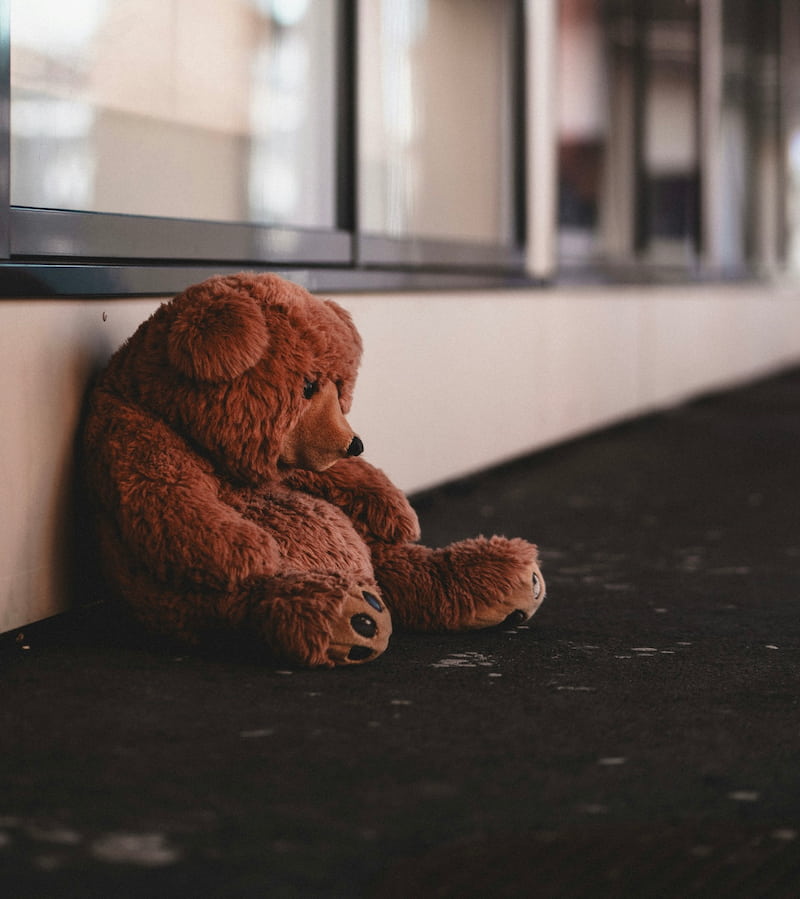 An image of a sad teddy bear, symbolizing the archetype of an orphan