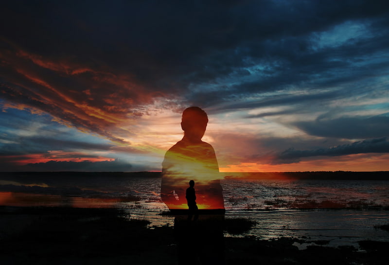 double exposure image of a man on a beach